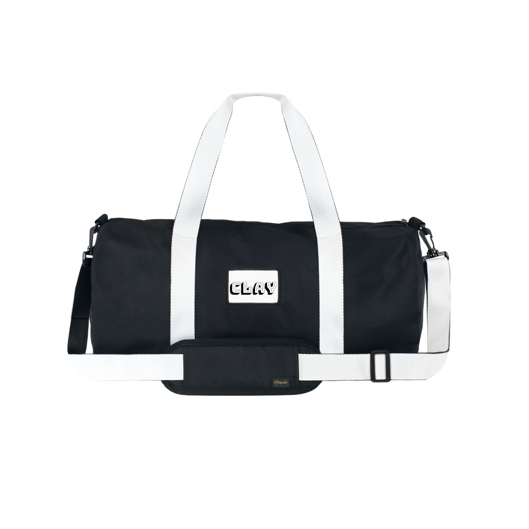 Black duffel or gym bag with white handles and white CLAY logo